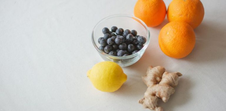 Ginger, oranges, blueberries and a lemon.