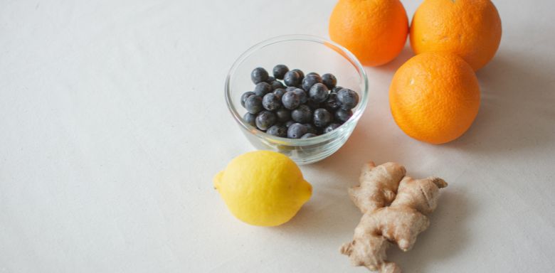 Ginger, oranges, blueberries and a lemon.