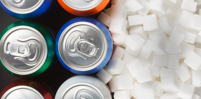 Cans of soda and sugar cubes.