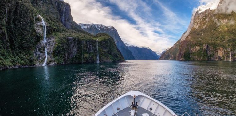 A view from the front of a boat of Milford Sound in New Zealand.